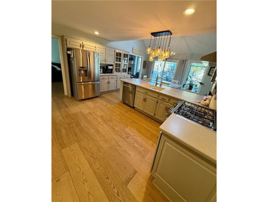 Beautifully updated and filled with natural light, this Leawood