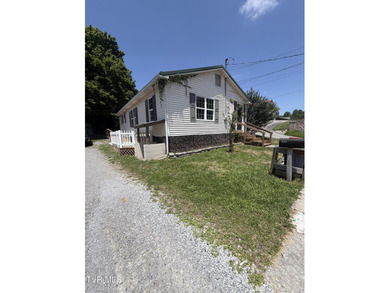 Charming, inviting, and full of potential! This 3-bedroom - photo 1