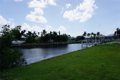 PRIME PGI WATERFRONT LOT WITH CONCRETE SEAWALL AND A SOUTHERN - photo 3