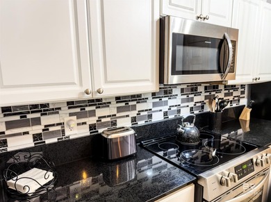 Welcome to this beautifully updated, ground-level condo that - photo 7