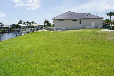 PRIME PGI WATERFRONT LOT WITH CONCRETE SEAWALL AND A SOUTHERN - photo 9