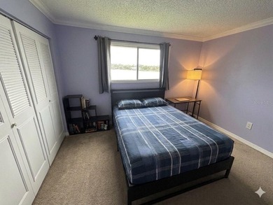Enjoy serene lakefront living in this beautifully maintained - photo 9