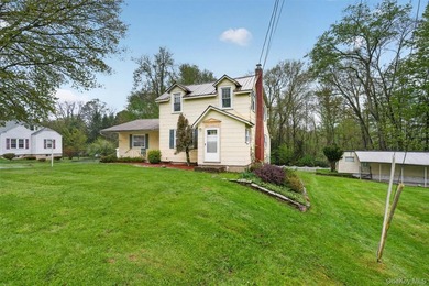 Sitting along the banks of the Neversink River, this waterfront - photo 3