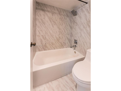 Condominium unit offering 3 bedrooms and 2 bathrooms with garden