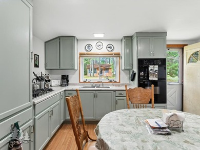 Tucked along 50 feet of coveted West Twin Lake frontage, this - photo 11