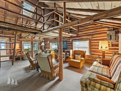 Tucked along 50 feet of coveted West Twin Lake frontage, this - photo 13