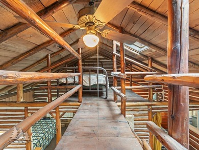 Tucked along 50 feet of coveted West Twin Lake frontage, this - photo 16