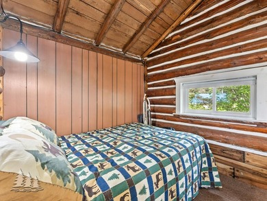 Tucked along 50 feet of coveted West Twin Lake frontage, this - photo 19