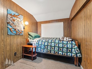Tucked along 50 feet of coveted West Twin Lake frontage, this - photo 20