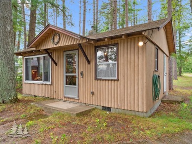 Tucked along 50 feet of coveted West Twin Lake frontage, this - photo 25