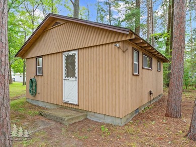 Tucked along 50 feet of coveted West Twin Lake frontage, this - photo 26