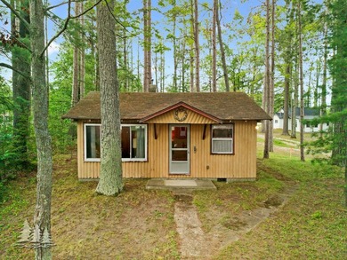 Tucked along 50 feet of coveted West Twin Lake frontage, this - photo 27