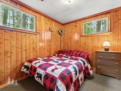Tucked along 50 feet of coveted West Twin Lake frontage, this - photo 33