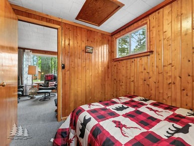 Tucked along 50 feet of coveted West Twin Lake frontage, this - photo 34