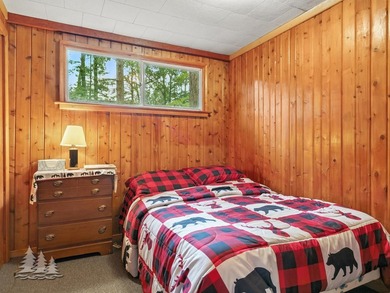 Tucked along 50 feet of coveted West Twin Lake frontage, this - photo 35