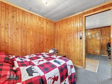 Tucked along 50 feet of coveted West Twin Lake frontage, this - photo 36