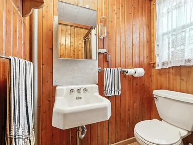 Tucked along 50 feet of coveted West Twin Lake frontage, this - photo 38