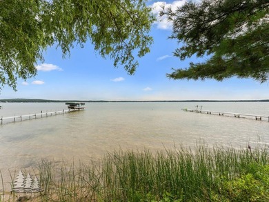 Tucked along 50 feet of coveted West Twin Lake frontage, this - photo 40