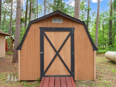 Tucked along 50 feet of coveted West Twin Lake frontage, this - photo 41