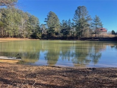 Over 7 1/2 acres of unrestricted land featuring a pond and - photo 10