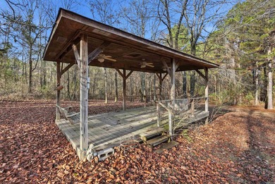 Set on 4.58 beautiful acres in Bauxite, just outside the city