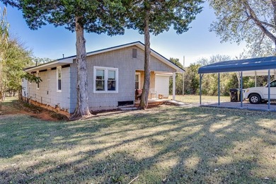 Endless potential on a beautiful corner lot! This fixer-upper