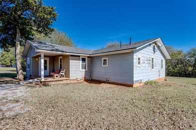Endless potential on a beautiful corner lot! This fixer-upper