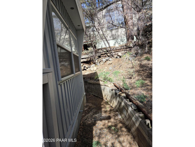 Nicely remodeled home featuring mature trees, a spacious deck
