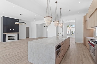 The Darien III by Romair is a custom residence with a detached - photo 11