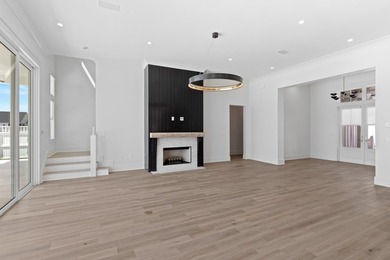 The Darien III by Romair is a custom residence with a detached - photo 12