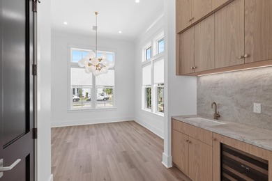 The Darien III by Romair is a custom residence with a detached - photo 16