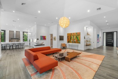A single-story masterpiece unfolds in the prestigious Royal Palm - photo 12