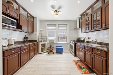 Welcome to this beautifully maintained detached two-family home - photo 13