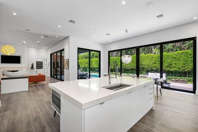 A single-story masterpiece unfolds in the prestigious Royal Palm - photo 17