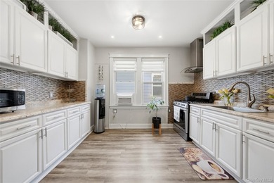 Welcome to this beautifully maintained detached two-family home - photo 25