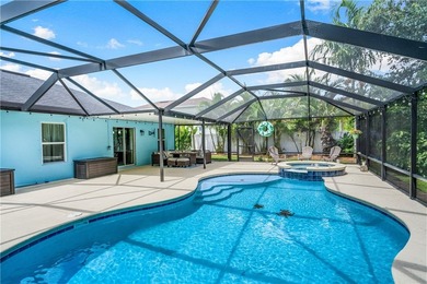 Nestled against a serene Florida preserve, this home features a - photo 1