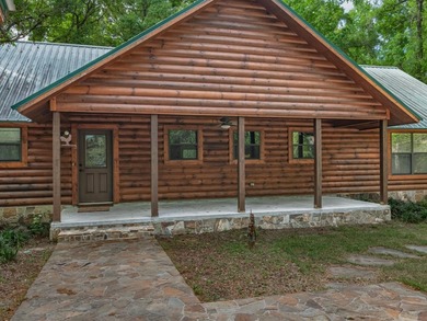 Nestled on over 17 acres this charming log home offers the - photo 3