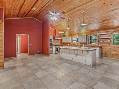Nestled on over 17 acres this charming log home offers the - photo 6