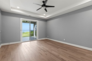Positioned on 1.5 acres in a gated waterfront community designed - photo 13