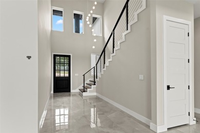 Positioned on 1.5 acres in a gated waterfront community designed - photo 17