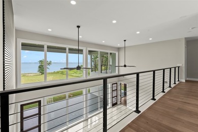 Positioned on 1.5 acres in a gated waterfront community designed - photo 18
