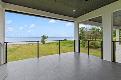 Positioned on 1.5 acres in a gated waterfront community designed - photo 22