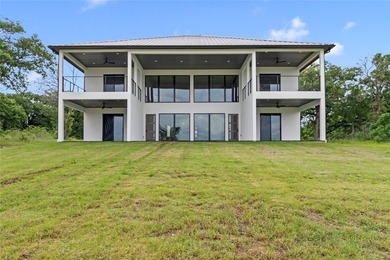 Positioned on 1.5 acres in a gated waterfront community designed - photo 35