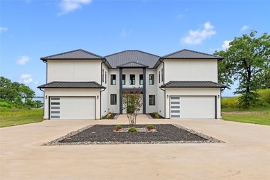 Positioned on 1.5 acres in a gated waterfront community designed - photo 37
