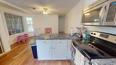 Back on the market and even better! Welcome home to this warm - photo 12