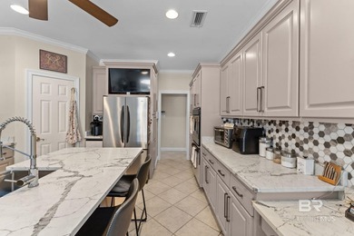 Nestled among mature trees and overlooking the 9th fairway, this - photo 4