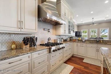 Set on an extraordinary 24.42-acre waterfront estate with - photo 22