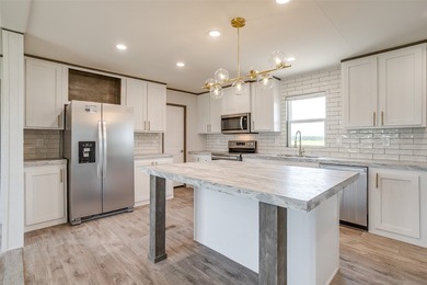 New Construction 5-bedroom, 3-bath home with a bonus room is - photo 5