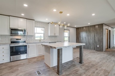 New Construction 5-bedroom, 3-bath home with a bonus room is - photo 6