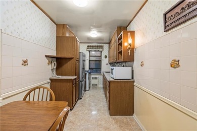 Welcome to 2465 Knapp Street #4F, a bright and beautifully lit